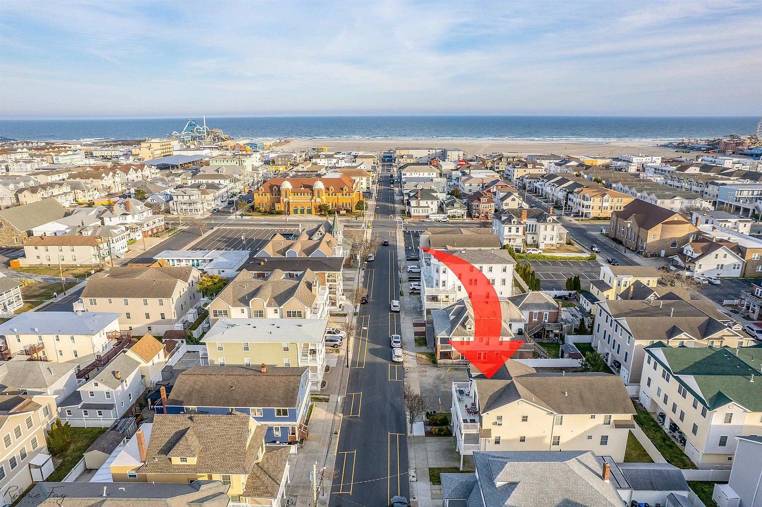 Aerial view of the house with the beach, ocean and boardwalk piers a short walk away